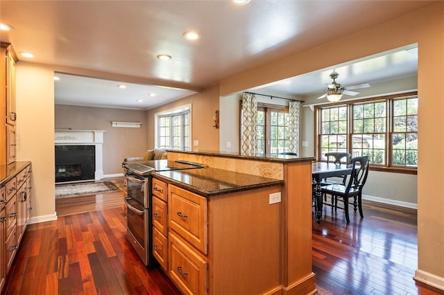 158 Pine Valley Dr, Greece, NY 14626 - kitchen featuring double oven range, dark wood finished floors, open floor plan, dark stone countertops, and recessed lighting
