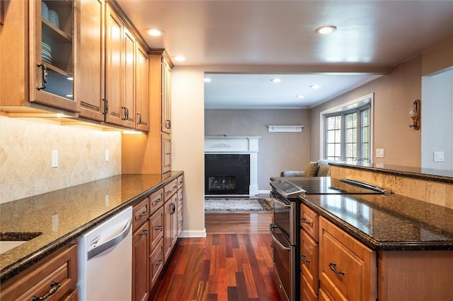 158 Pine Valley Dr, Greece, NY 14626 - kitchen featuring dishwasher, stainless steel range with electric stovetop, dark wood-style flooring, glass insert cabinets, and a fireplace