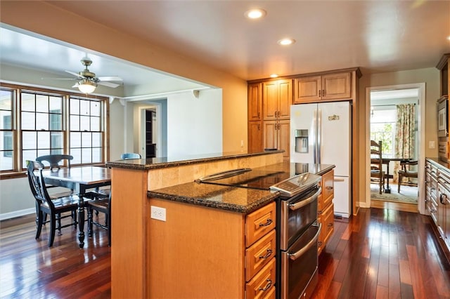158 Pine Valley Dr, Greece, NY 14626 - kitchen with stainless steel appliances, dark stone countertops, dark wood-type flooring, recessed lighting, and a ceiling fan