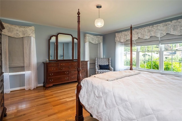 158 Pine Valley Dr, Greece, NY 14626 - bedroom featuring multiple windows and light wood-type flooring