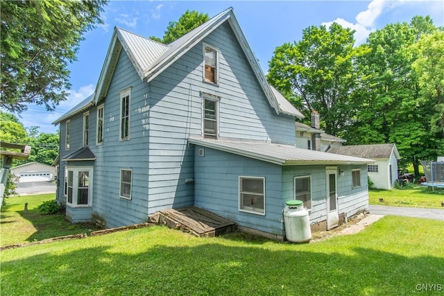14309 Maple St, Diana, NY 13648 - back of house featuring a lawn
