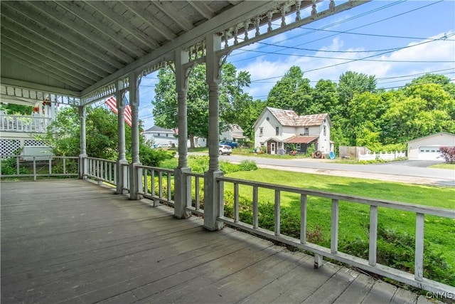 14309 Maple St, Diana, NY 13648 - wooden porch featuring a lawn