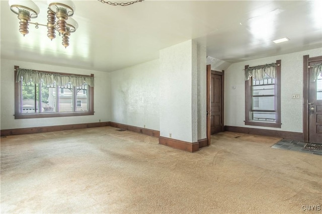 14309 Maple St, Diana, NY 13648 - unfurnished living room with carpet flooring and baseboards
