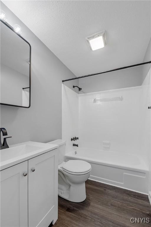 279 Watertree Dr, Dewitt, NY 13057 - full bathroom with vanity, wood finished floors, shower / washtub combination, and a textured ceiling