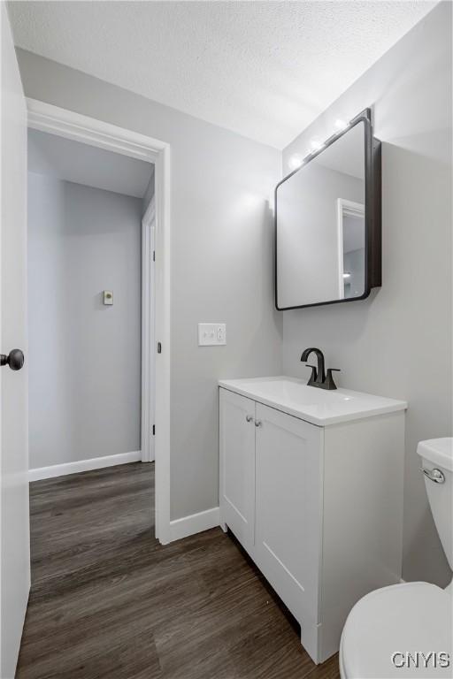 279 Watertree Dr, Dewitt, NY 13057 - bathroom featuring vanity and wood finished floors