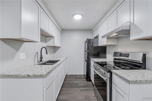 279 Watertree Dr, Dewitt, NY 13057 - kitchen featuring under cabinet range hood, electric stove, dark wood finished floors, white cabinets, and freestanding refrigerator