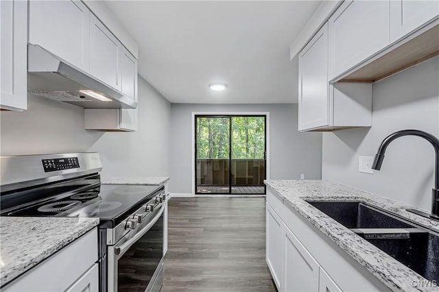279 Watertree Dr, Dewitt, NY 13057 - kitchen with electric range, exhaust hood, white cabinetry, wood finished floors, and light stone counters