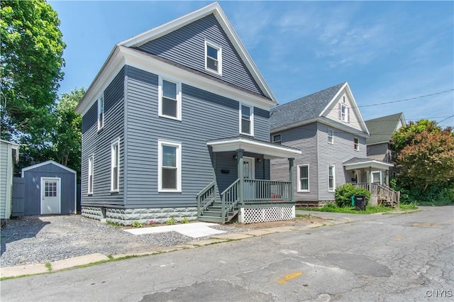 807 Bingham Ave, Watertown City, NY 13601 - traditional style home featuring a storage shed and covered porch