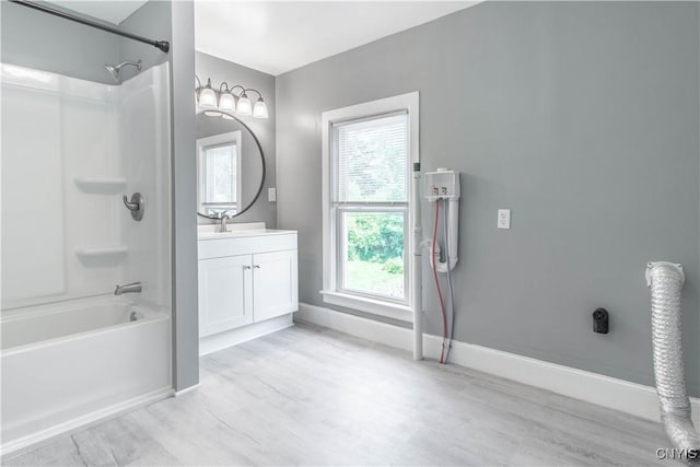 807 Bingham Ave, Watertown City, NY 13601 - bathroom featuring vanity, shower / bath combination, and wood finished floors