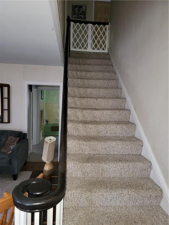 25 Francis Ave, Norwich, NY 13815 - staircase featuring baseboards