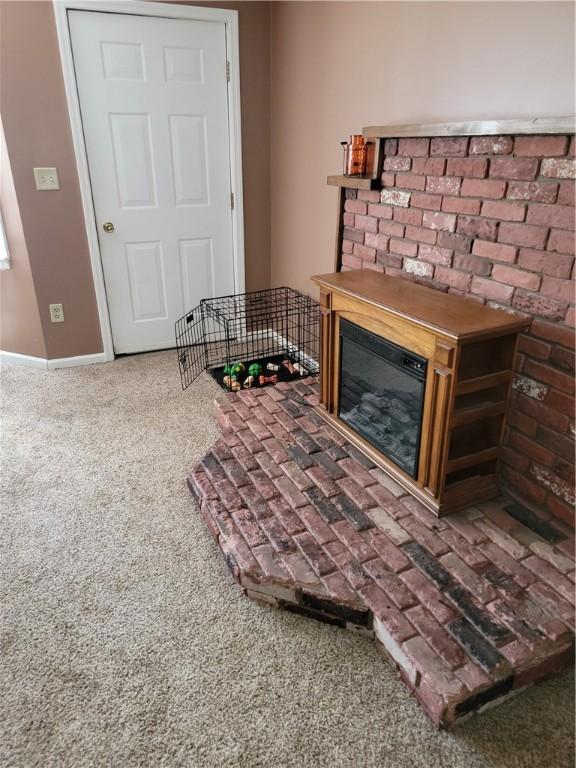 25 Francis Ave, Norwich, NY 13815 - living room featuring carpet flooring and a glass covered fireplace