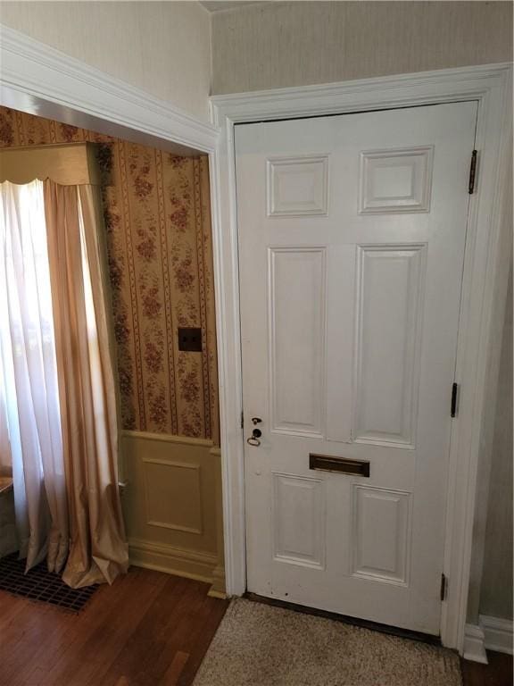 25 Francis Ave, Norwich, NY 13815 - entryway with wallpapered walls, wood finished floors, a wainscoted wall, and a decorative wall