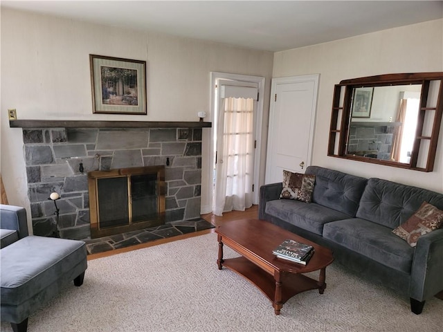 25 Francis Ave, Norwich, NY 13815 - living room featuring a stone fireplace and carpet
