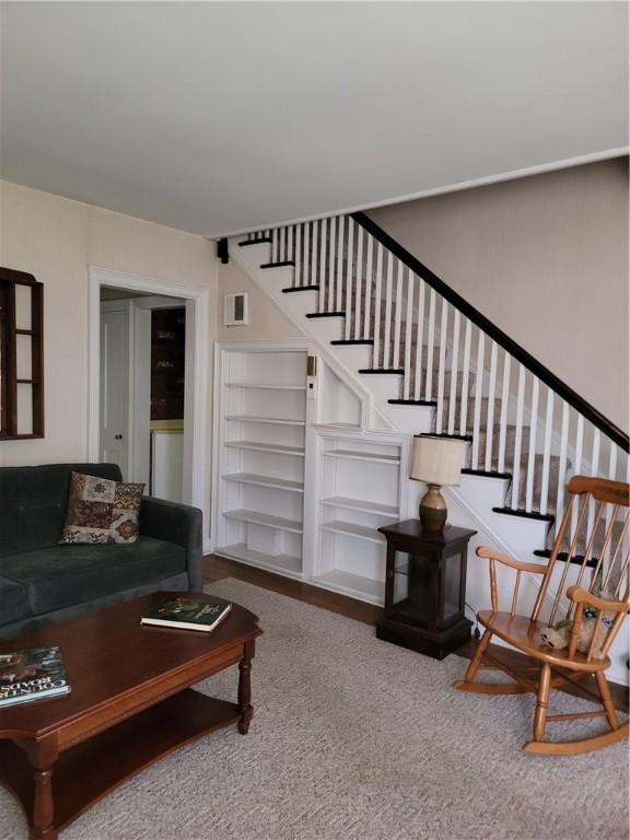 25 Francis Ave, Norwich, NY 13815 - carpeted living area featuring stairway