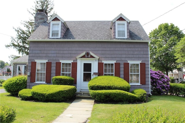 25 Francis Ave, Norwich, NY 13815 - view of front of property featuring a chimney, roof with shingles, a front lawn, and entry steps