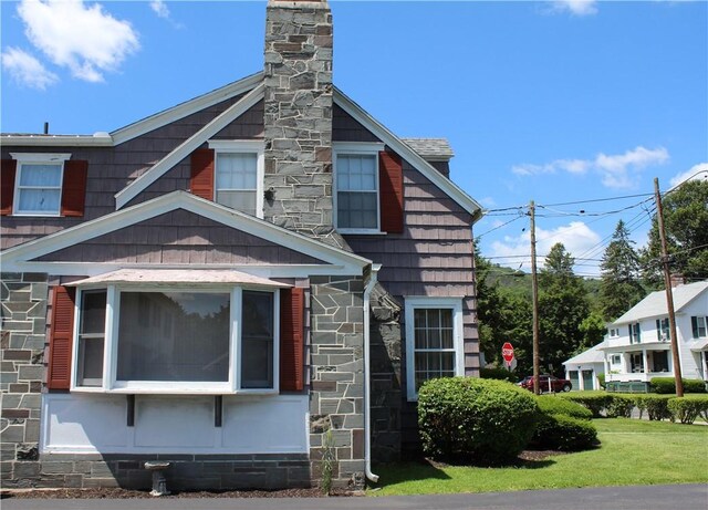 25 Francis Ave, Norwich, NY 13815 - view of side of home with a chimney