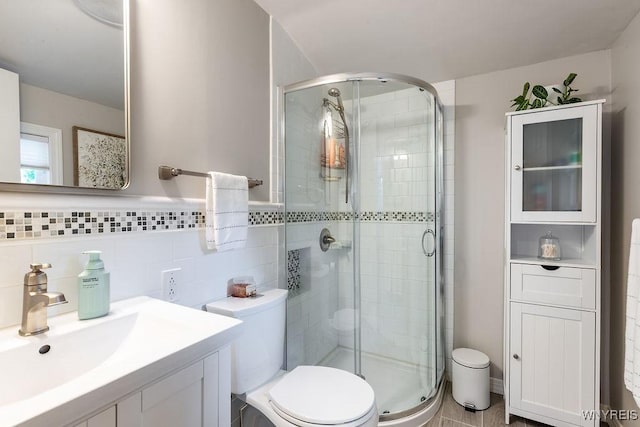 760 Westbrook Dr, North Tonawanda, NY 14120 - full bathroom with a shower stall, vanity, and tile walls