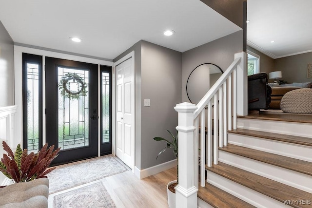 760 Westbrook Dr, North Tonawanda, NY 14120 - foyer featuring light wood-type flooring, stairway, recessed lighting, and ornamental molding