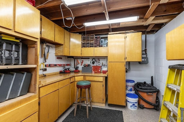 760 Westbrook Dr, North Tonawanda, NY 14120 - kitchen featuring light countertops and concrete block wall