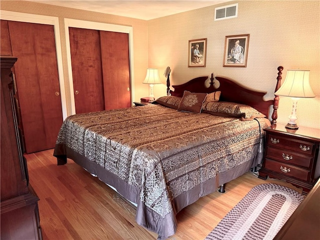 818 Tinker Tavern Rd, Webster, NY 14580 - bedroom with wood finished floors and multiple closets