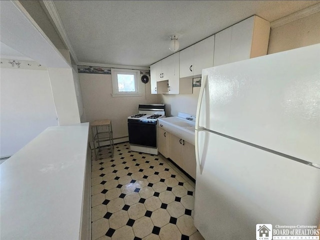 515 Newland Ave, Jamestown, NY 14701 - kitchen featuring white appliances, light floors, white cabinets, and light countertops