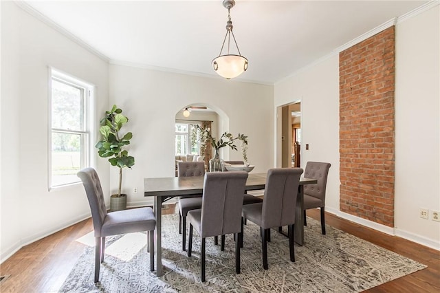 190 Laburnam Cres, Rochester, NY 14620 - dining room with arched walkways, wood finished floors, and crown molding