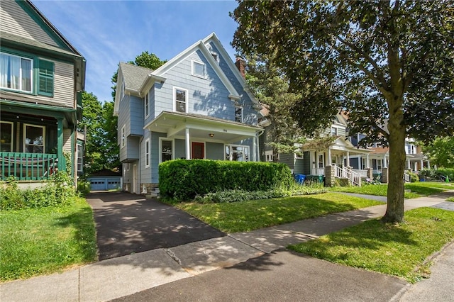 190 Laburnam Cres, Rochester, NY 14620 - view of front facade featuring a chimney, a porch, and a front yard
