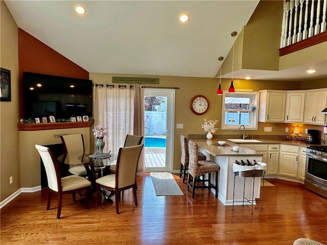 187 Seaward Ave, Bradford-City, PA 16701 - dining area featuring wood finished floors, high vaulted ceiling, and recessed lighting