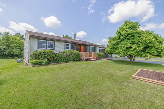 244 Wildflower Dr, Henrietta, NY 14623 - view of front facade with a front yard and an attached garage