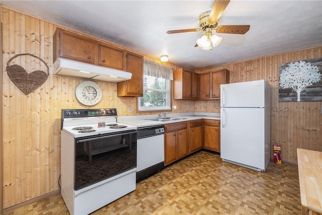 244 Wildflower Dr, Henrietta, NY 14623 - kitchen featuring white appliances, under cabinet range hood, wood walls, light countertops, and ceiling fan