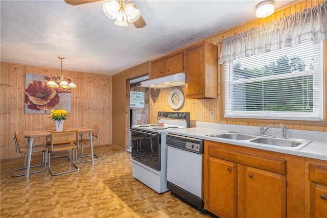 244 Wildflower Dr, Henrietta, NY 14623 - kitchen featuring white appliances, wood walls, under cabinet range hood, light countertops, and ceiling fan