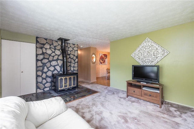 244 Wildflower Dr, Henrietta, NY 14623 - carpeted living room with a wood stove and a textured ceiling
