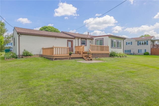 244 Wildflower Dr, Henrietta, NY 14623 - rear view of house featuring a wooden deck and a yard