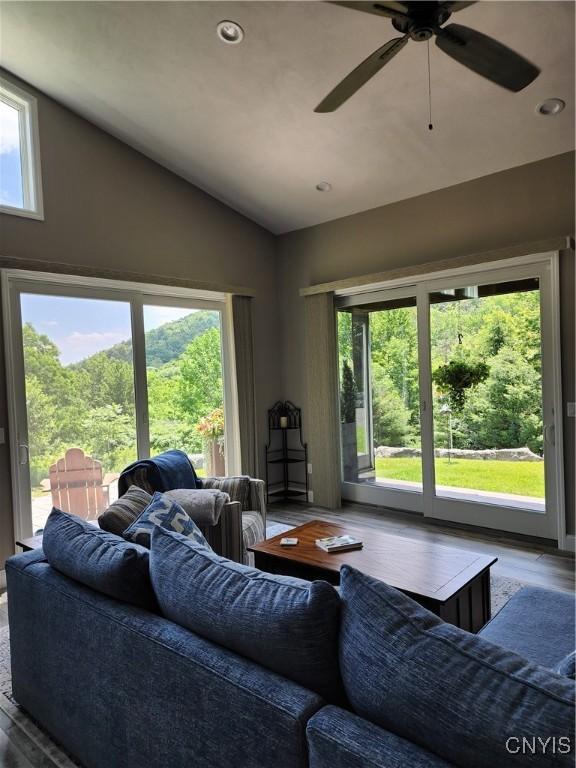 1683 Song Mountain Rd, Preble, NY 13141 - living room featuring vaulted ceiling, healthy amount of natural light, ceiling fan, wood finished floors, and recessed lighting