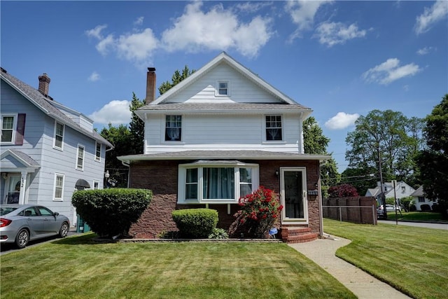 138 Cherry Rd, Rochester, NY 14612 - american foursquare style home with entry steps, a front yard, and brick siding