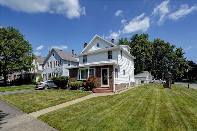 138 Cherry Rd, Rochester, NY 14612 - traditional style home with a front lawn, a chimney, and brick siding