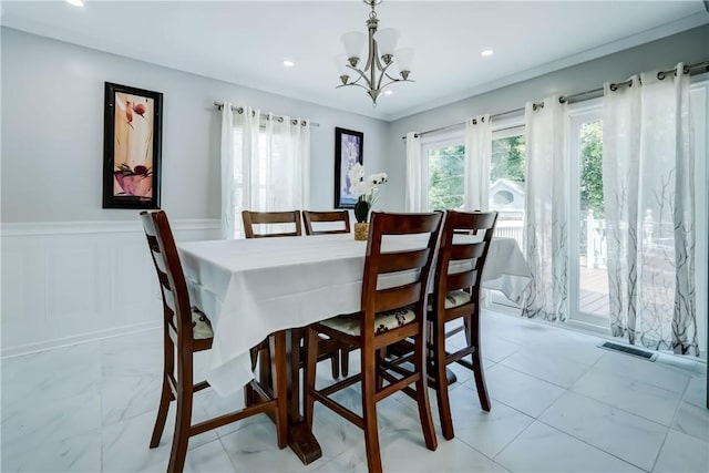 138 Cherry Rd, Rochester, NY 14612 - dining area with a chandelier, wainscoting, and recessed lighting