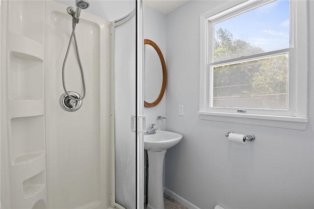 5808 W Wautoma Beach Rd, Hamlin, NY 14468 - bathroom featuring a shower stall and baseboards