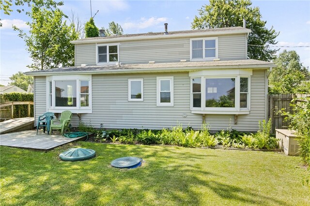 5808 W Wautoma Beach Rd, Hamlin, NY 14468 - rear view of house featuring a wooden deck and a chimney