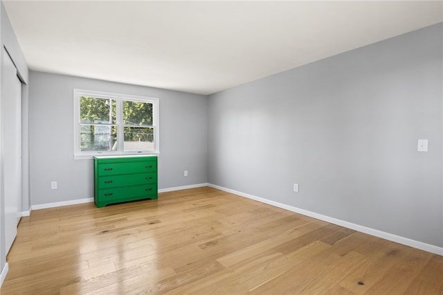 5808 W Wautoma Beach Rd, Hamlin, NY 14468 - spare room featuring light wood-style flooring and baseboards