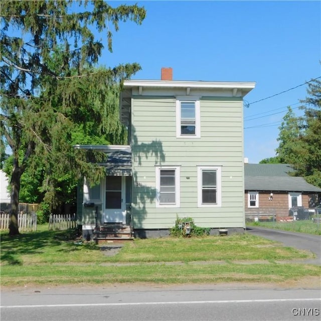 205 Hartwell Ave, Dewitt, NY 13057 - view of front facade with a chimney and entry steps
