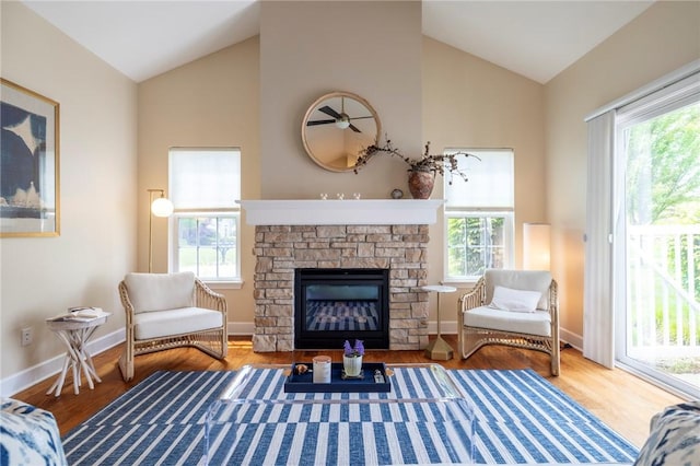 246 Maryview Dr, Penfield, NY 14580 - living area featuring vaulted ceiling, healthy amount of natural light, and wood finished floors