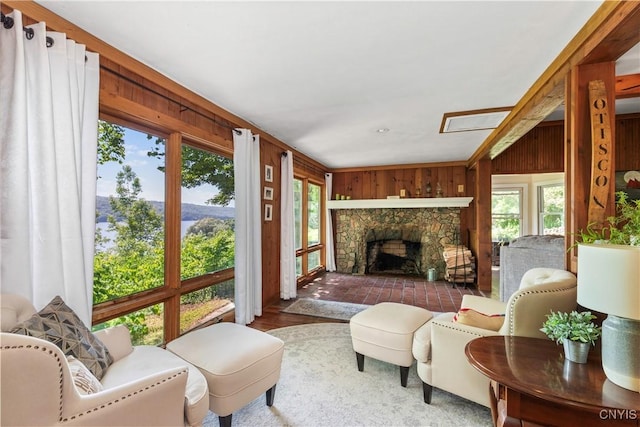 1848 Otisco Valley Rd, Otisco, NY 13110 - living area with wooden walls, a fireplace, and wood finished floors