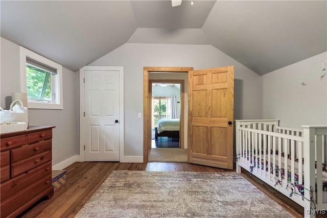 1848 Otisco Valley Rd, Otisco, NY 13110 - bedroom featuring wood finished floors, lofted ceiling, and a nursery area