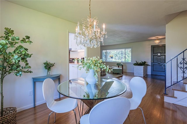 164 Queens Ln, Irondequoit, NY 14617 - dining room with wood finished floors, stairs, and a chandelier