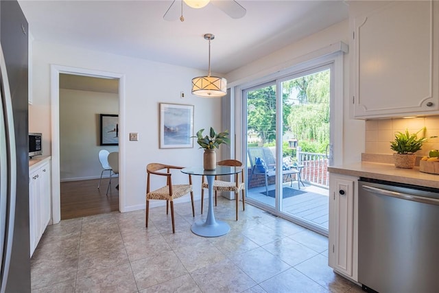 164 Queens Ln, Irondequoit, NY 14617 - dining room with ceiling fan and baseboards