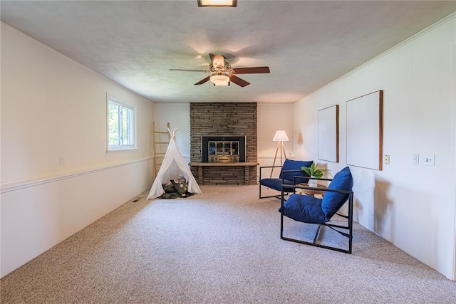 164 Queens Ln, Irondequoit, NY 14617 - sitting room with carpet floors, ceiling fan, and a fireplace