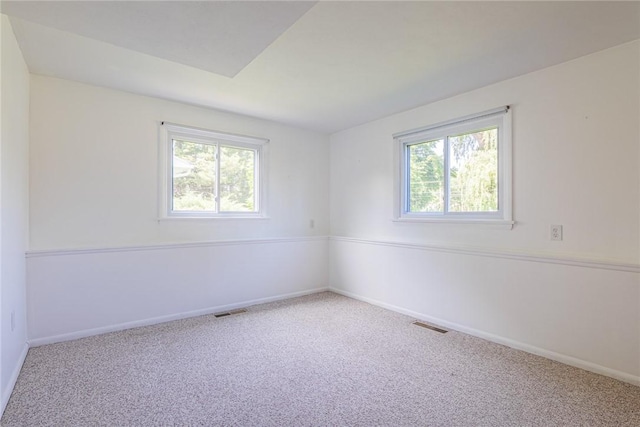 164 Queens Ln, Irondequoit, NY 14617 - carpeted empty room featuring plenty of natural light