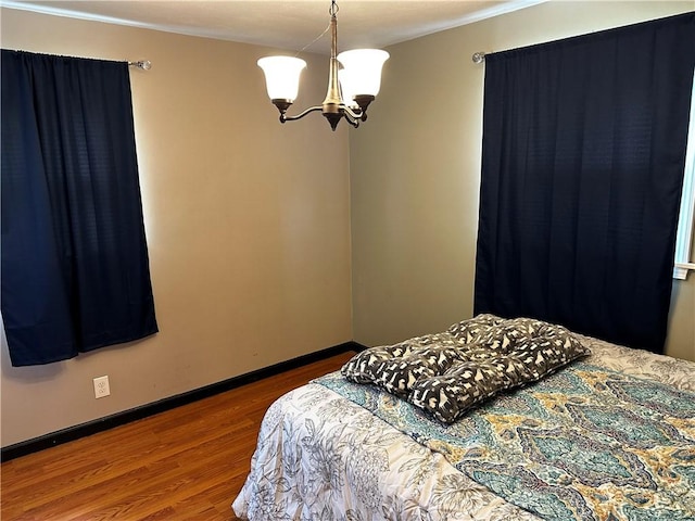 171 Vinal Ave, Irondequoit, NY 14609 - bedroom with a chandelier, wood finished floors, and ornamental molding