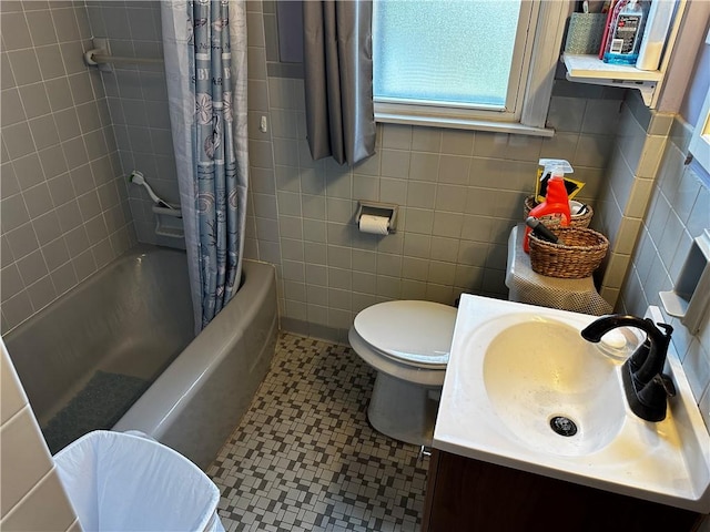 171 Vinal Ave, Irondequoit, NY 14609 - bathroom featuring tile walls, shower / bathtub combination with curtain, vanity, and tile patterned floors
